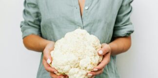 person holding cauliflower